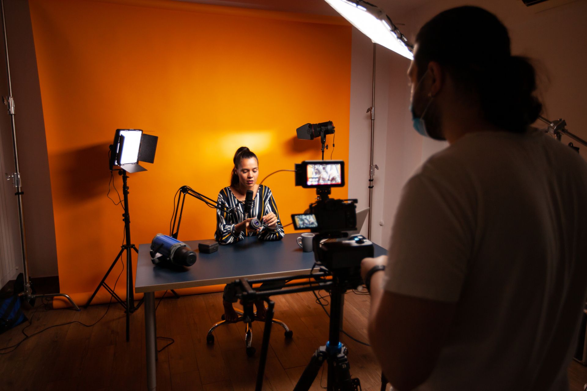 Filming influencer recording in home studio with lights ,cameras and microphones