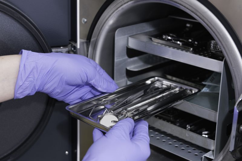 Medical instruments on a tray about to be placed in a sterilisation machine 