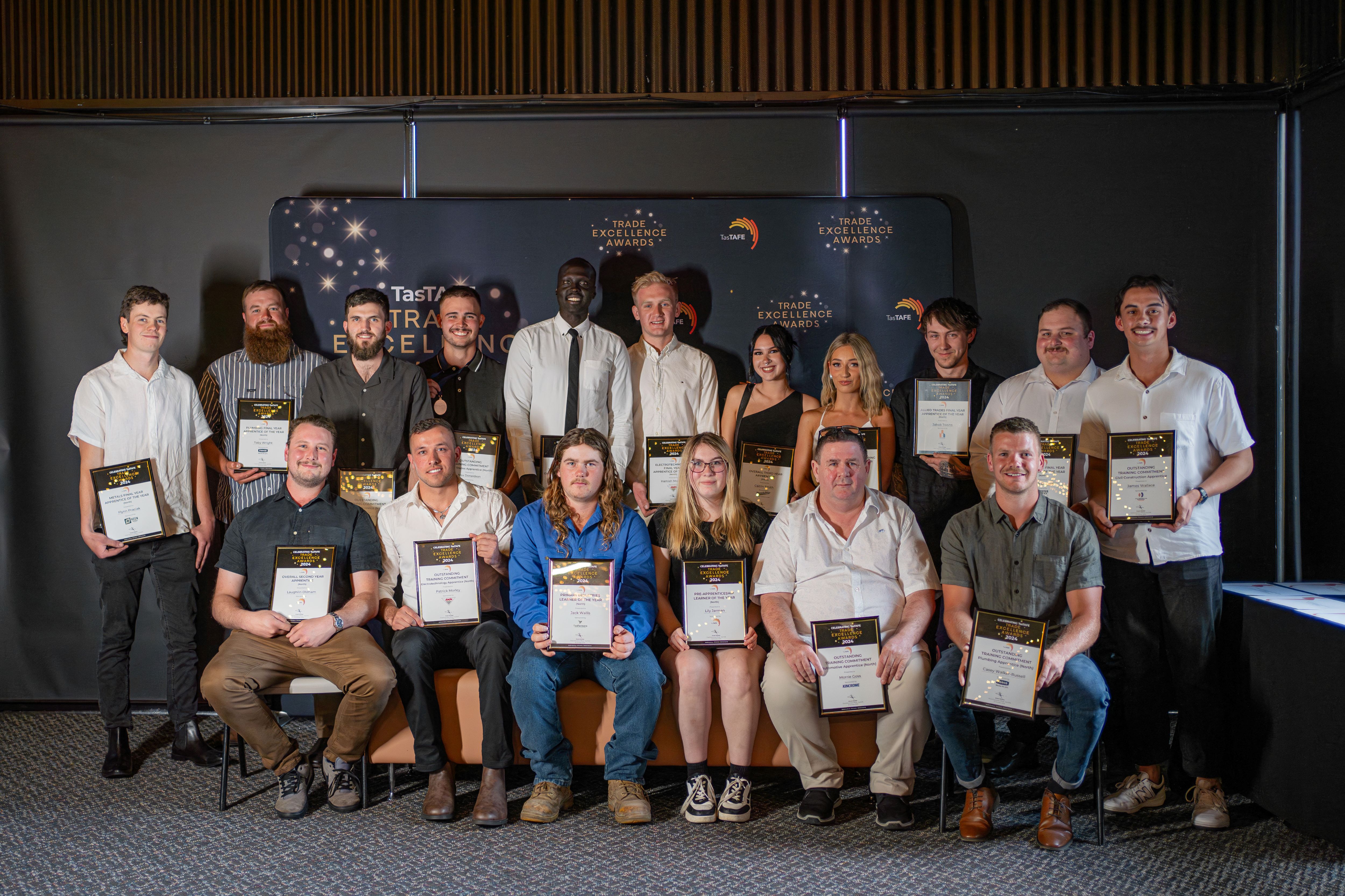 Group photo of all the TasTAFE Trade Excellence award winners from the Northern Tasmania region, each holding their certificate