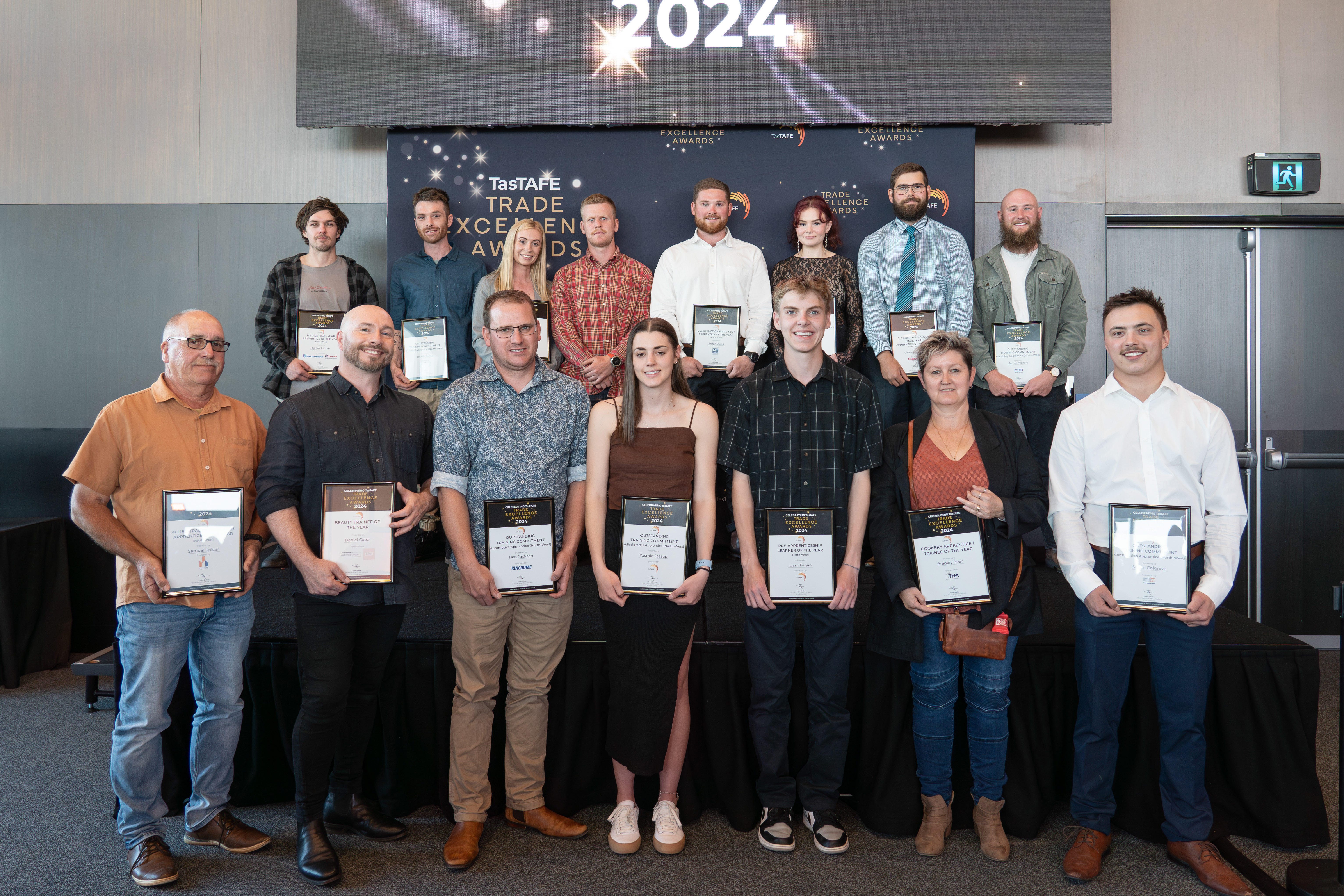 Group photo of all the TasTAFE Trade Excellence award winners from the north-west Tasmania region, each holding their certificate